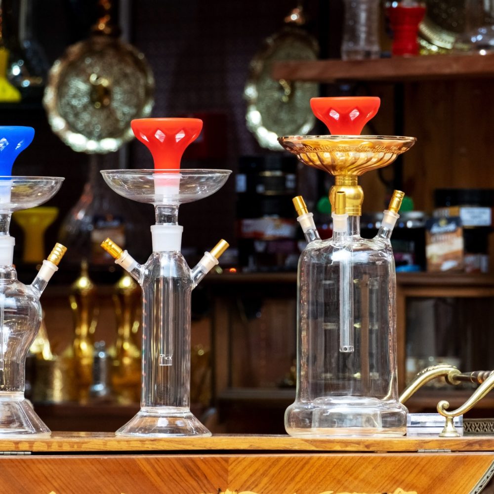 Glass shisha vases in smoke shop.